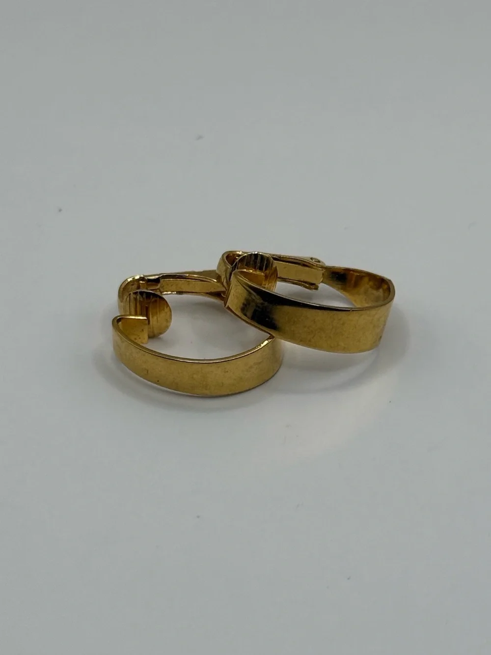 Vintage crown Trifari gold tone clip-on hoop earrings